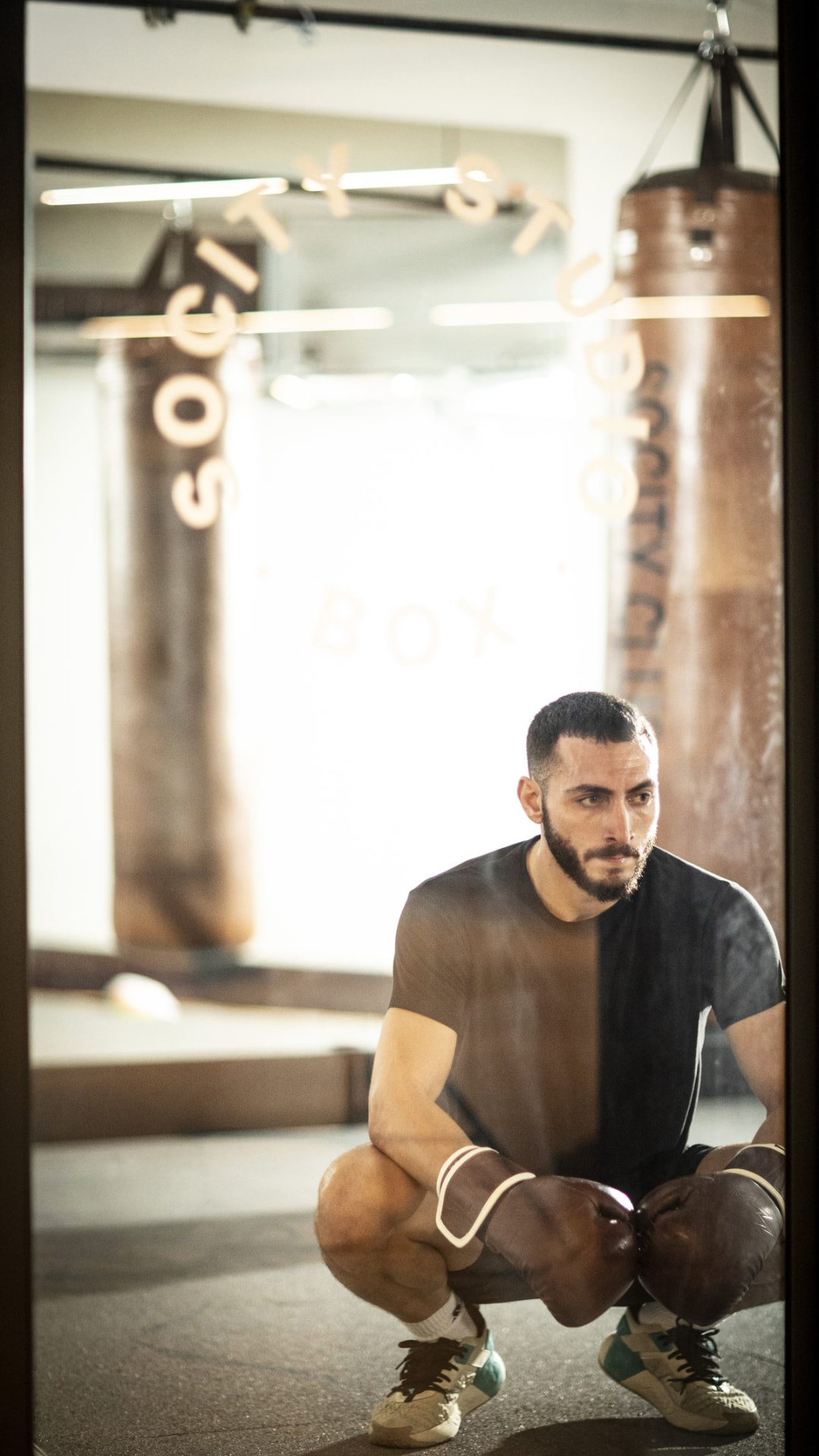 A boxer resting in the Socity Studio boxing room