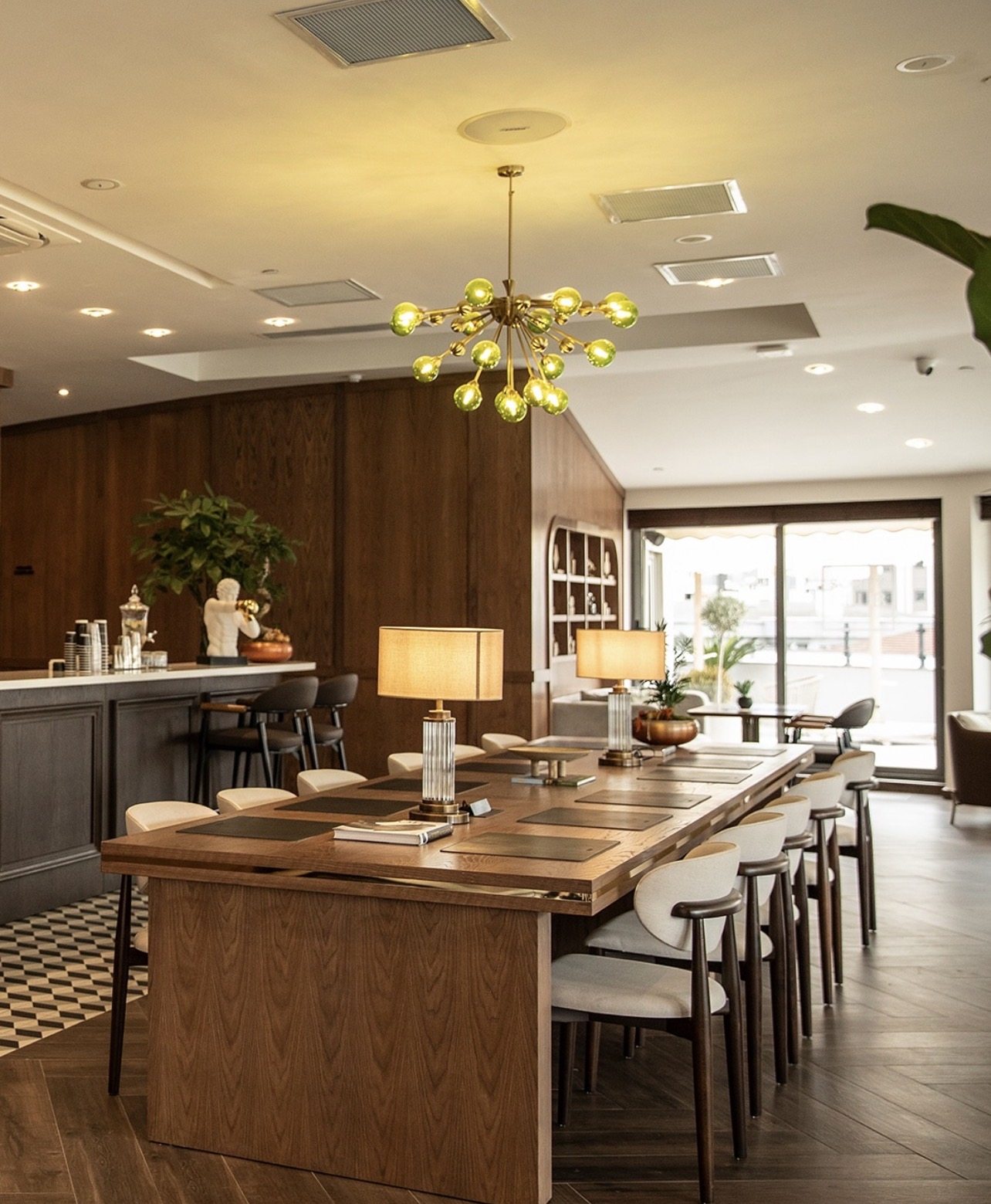 The Socity Club lounge, cedar and travertine bar with communal table